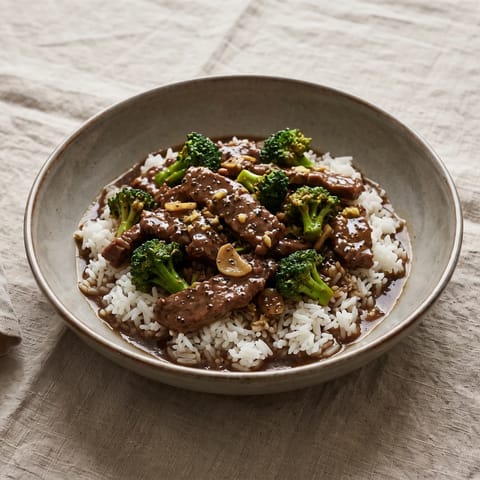 Beef & Broccoli in Black Pepper Sauce with Rice - Glossy black-pepper beef with broccoli over steamed rice