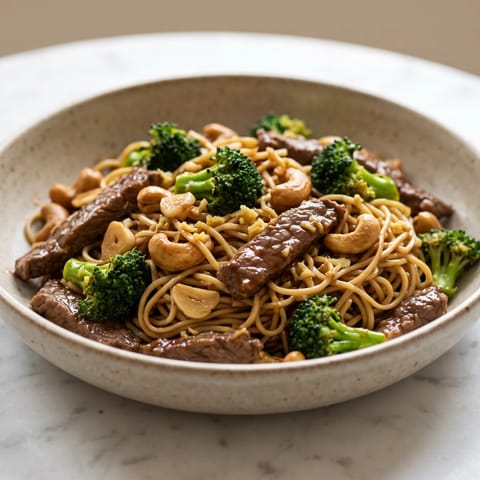 Beef, Broccoli & Cashew Stir-Fry with Noodles - Quick-seared beef with broccoli, cashews and egg noodles in a ginger-tamari sauce