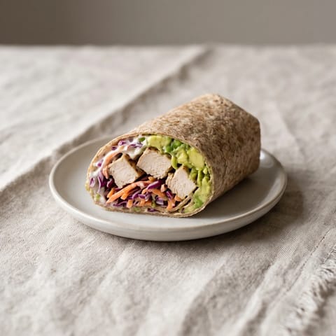 Chicken, Avocado & Slaw Whole-Grain Wrap - Freshly cooked chicken (not deli meat) with crunchy slaw and avocado