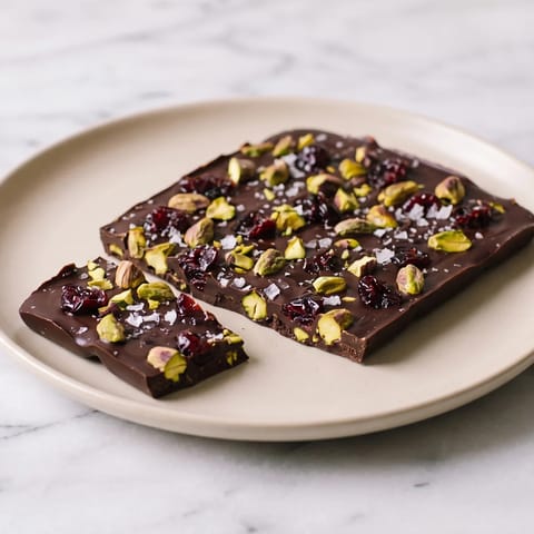Dark Chocolate & Pistachio Bark with Sea Salt - Snappy dark chocolate bark studded with pistachios, dried cherries and sea salt