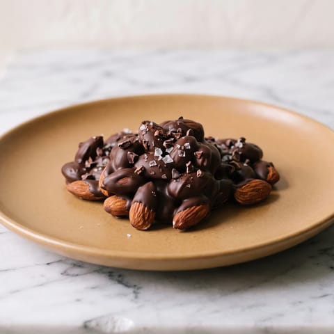 Dark Chocolate & Sea Salt Almond Clusters - Roasted almonds bound in dark chocolate with flaky salt