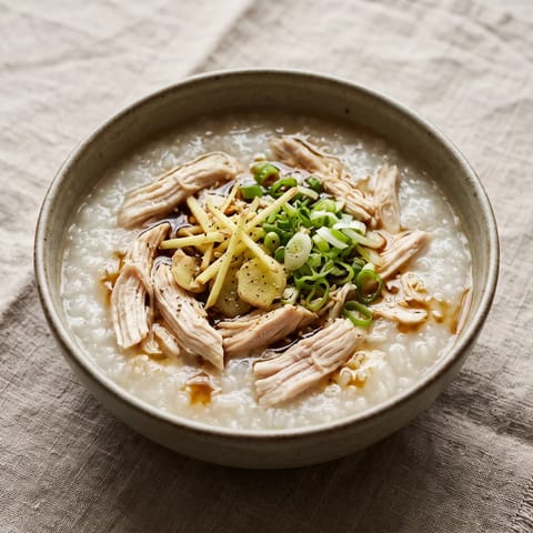 Ginger & Scallion Chicken Congee - Silky rice congee with poached chicken, ginger and scallions