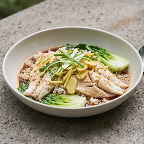 Ginger & Scallion Steamed Fish with Rice - Cantonese-style steamed sea bass or trout showered with hot ginger-scallion oil