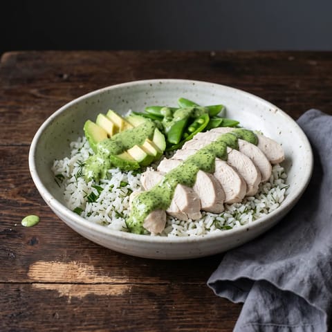 Green Goddess Chicken & Avocado Bowls - Poached chicken and avocado over herby rice with a green goddess yogurt dressing that you will want on everything else too.