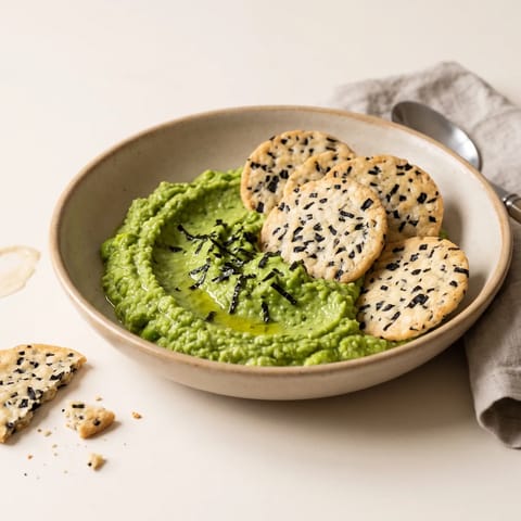 Miso & Seaweed Rice Crackers with Edamame Dip - A vivid green edamame and miso dip with crisp seaweed rice crackers