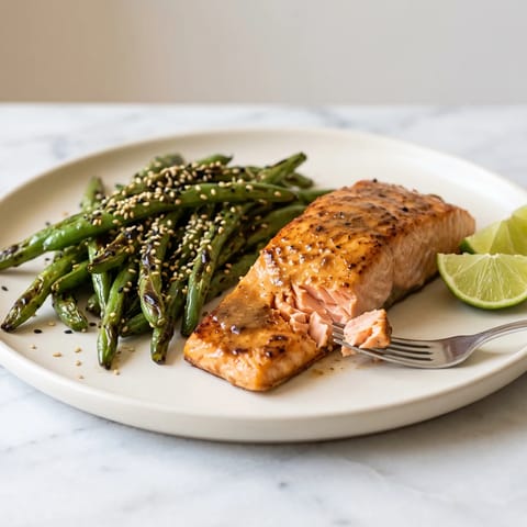 Miso-Butter Salmon with Sesame Green Beans - Roasted salmon glazed with miso butter beside blistered sesame green beans