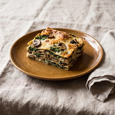 Mushroom & Spinach Lasagna - Layers of garlicky mushrooms, spinach and creamy bechamel between pasta sheets
