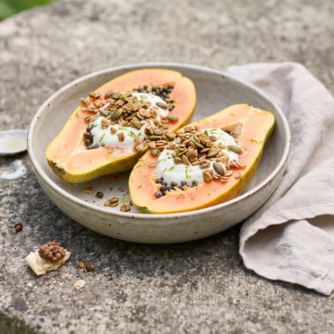 Papaya Boats with Lime, Yogurt & Granola - Ripe papaya halves filled with vanilla yogurt, granola and lime