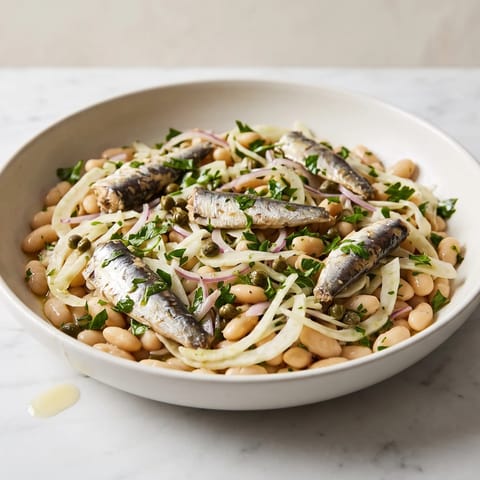 Sardine, White Bean & Fennel Salad - Sardines laid over a lemony white bean and shaved fennel salad with capers and parsley