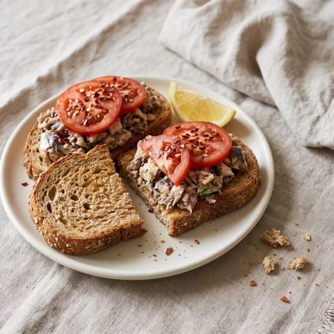 Sardines on Toast with Tomato & Lemon - Canned sardines mashed with lemon and piled on hot toast with juicy tomatoes