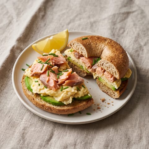 Smoked Salmon, Egg & Avocado Bagel Plate - A toasted bagel stacked with hot-smoked salmon, scrambled eggs and avocado