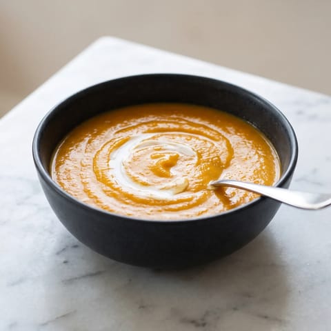 Spiced Carrot, Red Lentil & Coconut Soup - A silky carrot and red lentil soup with cumin, ginger and a swirl of coconut