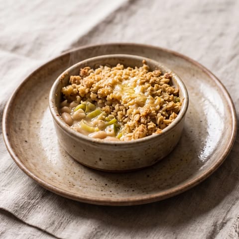 White Bean, Leek & Cheddar Crumble Pot - Creamy leeks and white beans under a savory oat-cheddar crumble