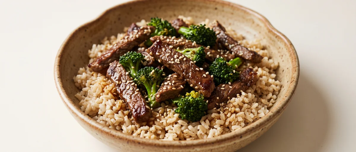 Beef & Broccoli Grain Bowl with Tamari Dressing - Seared beef strips over brown rice and broccoli with a gingery tamari dressing