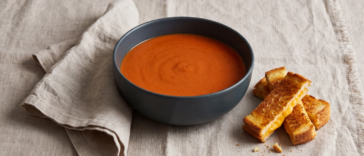 Creamy Tomato & Red Lentil Soup with Grilled Cheese Dippers - Velvety tomato soup thickened with red lentils, plus grilled-cheese dippers for dunking