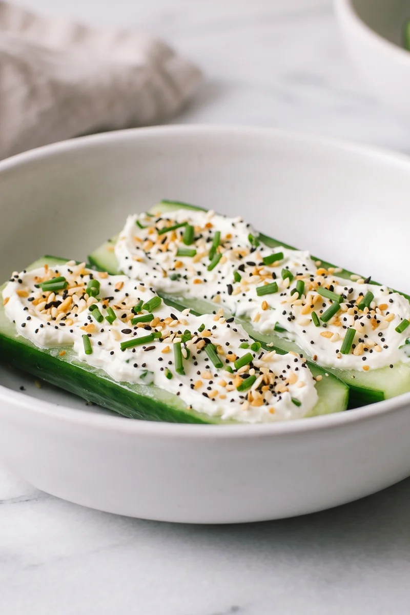 Everything Bagel Cream Cheese Cucumber Boats - Cucumber halves loaded with chive cream cheese and everything-bagel seeds