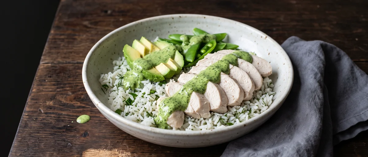 Green Goddess Chicken & Avocado Bowls - Poached chicken and avocado over herby rice with a green goddess yogurt dressing that you will want on everything else too.