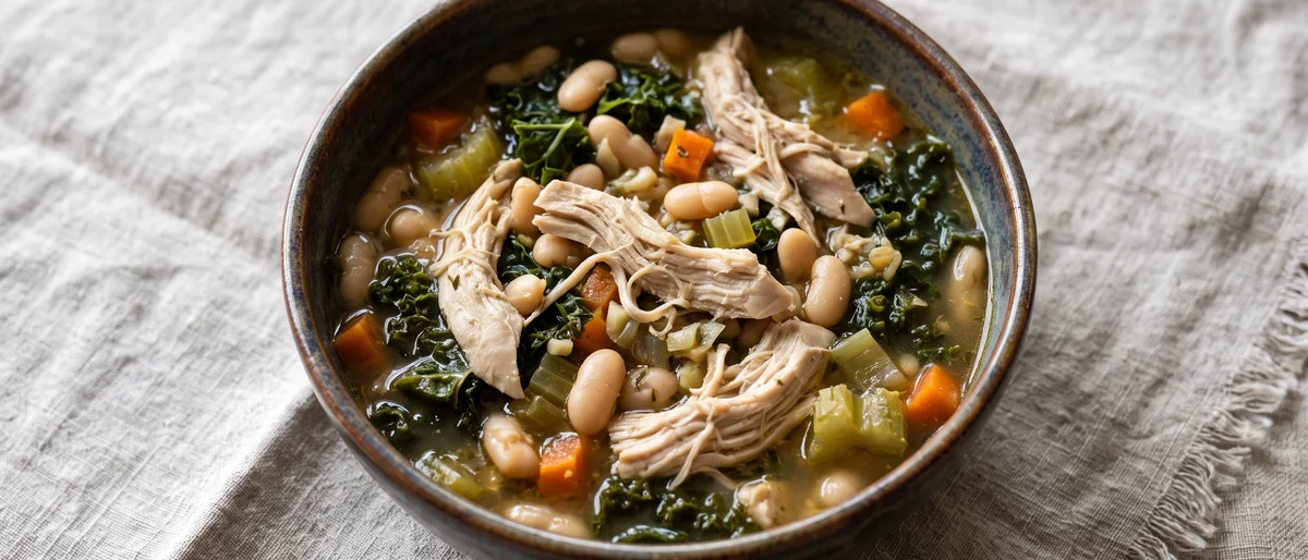 Hearty Chicken, Kale & White Bean Stew - A slow-feeling one-pot chicken stew with kale and white beans