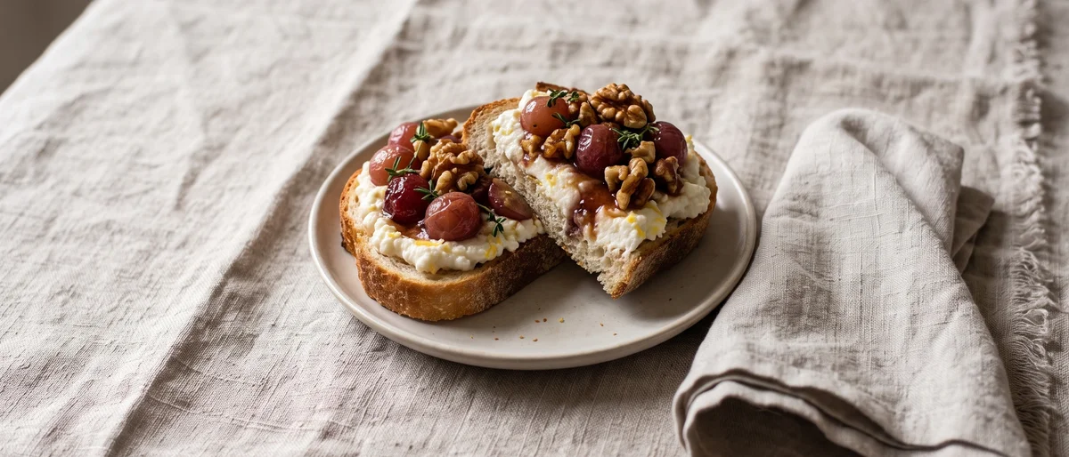 Loaded Ricotta Toast with Roasted Grapes & Walnuts - Warm toast with lemony ricotta under sticky roasted grapes and toasted walnuts