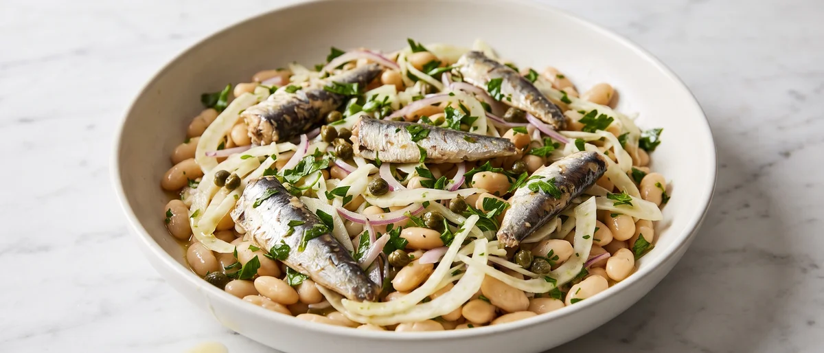 Sardine, White Bean & Fennel Salad - Sardines laid over a lemony white bean and shaved fennel salad with capers and parsley