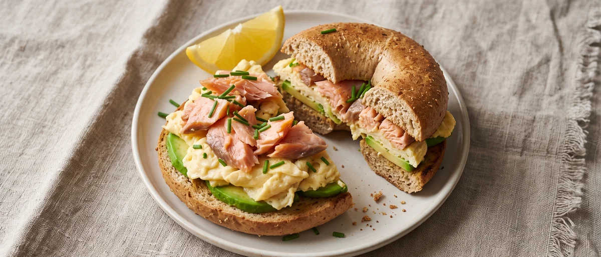 Smoked Salmon, Egg & Avocado Bagel Plate - A toasted bagel stacked with hot-smoked salmon, scrambled eggs and avocado