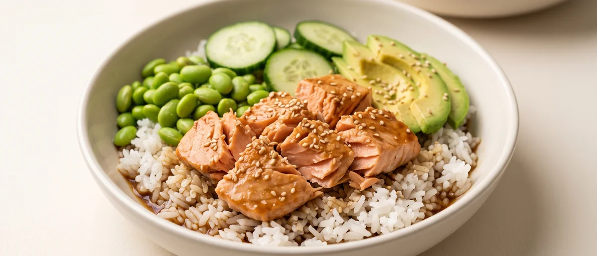 Teriyaki-Style Salmon Rice Bowls - Sticky glazed salmon over rice with cucumber, avocado and edamame
