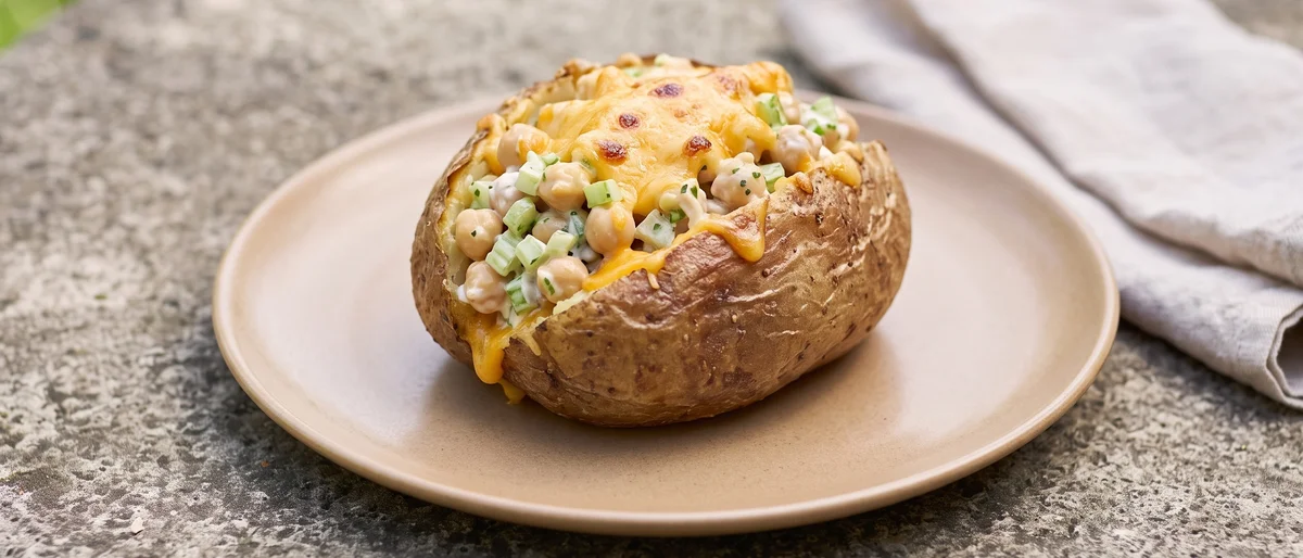 Tuna-Free Chickpea Melt Baked Potatoes - Crisp baked potatoes with lemony chickpea salad and broiled cheddar
