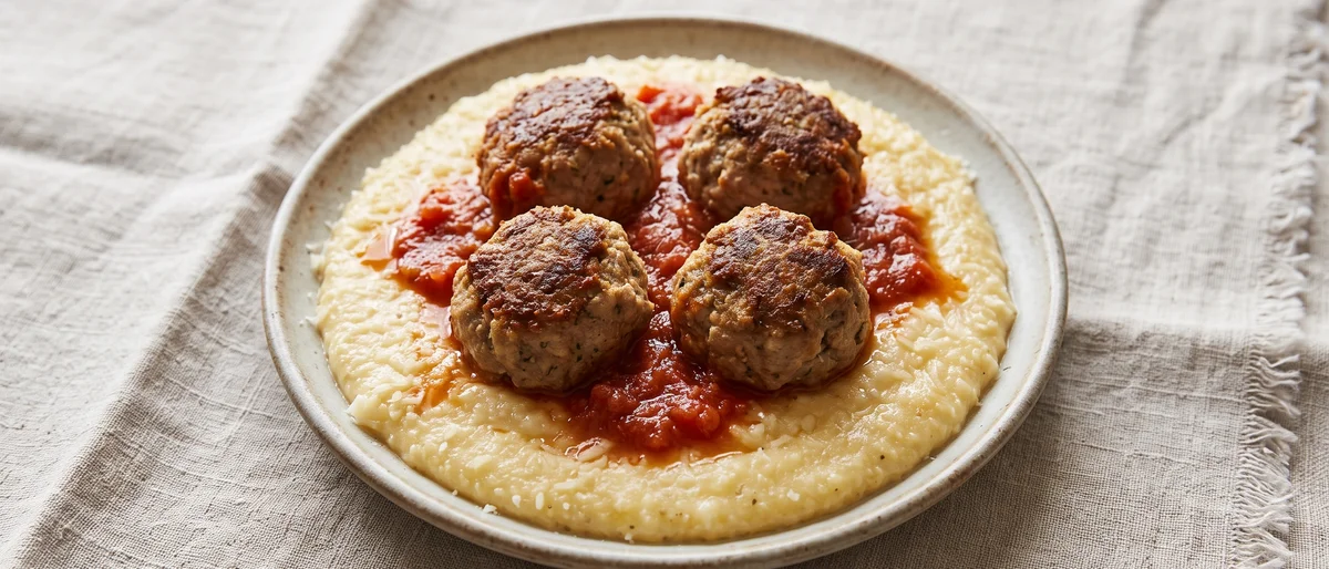 Turkey Meatballs in Tomato Sauce with Polenta - Tender turkey meatballs over soft Parmesan polenta